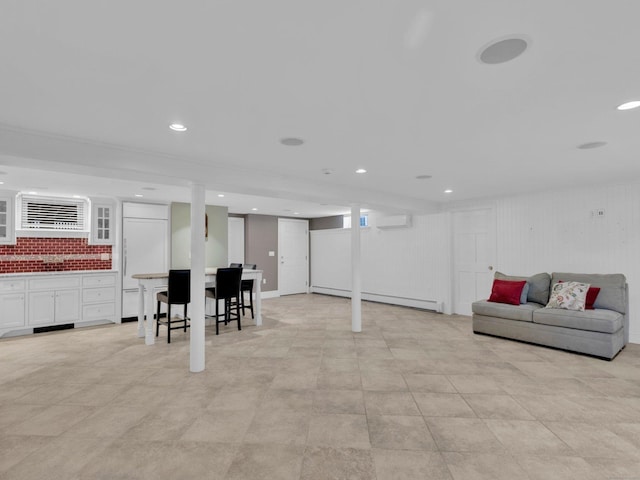 226 Alberta St, Fairfield, CT 06825 - finished below grade area with an AC wall unit, baseboard heating, and recessed lighting