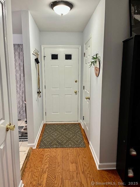 6 Hakim St Unit 2-6, Danbury, CT 06810 - doorway with wood finished floors and baseboards