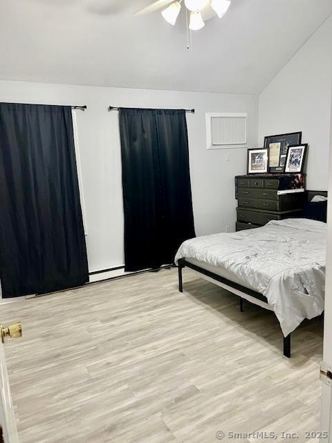 6 Hakim St Unit 2-6, Danbury, CT 06810 - bedroom with vaulted ceiling, light wood-style floors, and ceiling fan