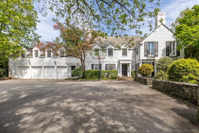 37 Hunting Hill Rd, Woodbridge, CT 06525 - view of front of home with a chimney and driveway