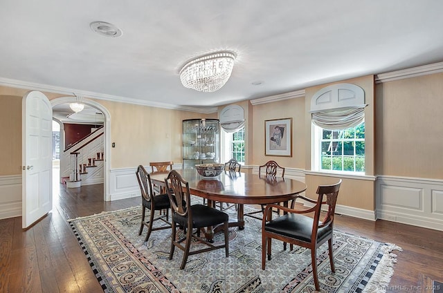 37 Hunting Hill Rd, Woodbridge, CT 06525 - dining room featuring dark wood-type flooring, wainscoting, arched walkways, stairs, and a chandelier