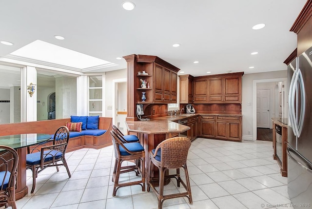 37 Hunting Hill Rd, Woodbridge, CT 06525 - kitchen featuring a peninsula, recessed lighting, open shelves, stone counters, and light tile patterned flooring