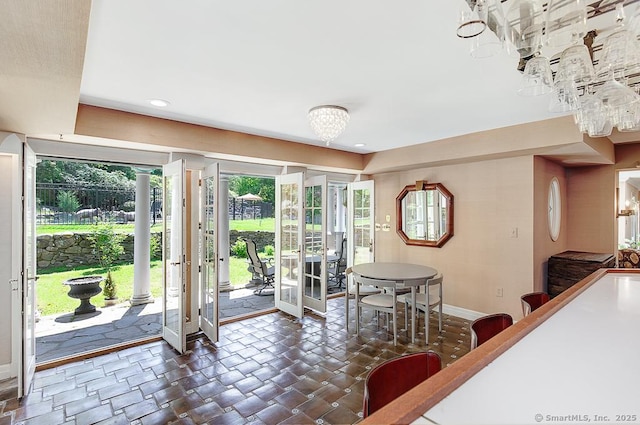 37 Hunting Hill Rd, Woodbridge, CT 06525 - dining area featuring a chandelier, baseboards, dark stone finish flooring, and recessed lighting