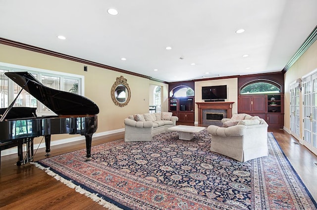 37 Hunting Hill Rd, Woodbridge, CT 06525 - living room with wood finished floors, ornamental molding, recessed lighting, a high end fireplace, and baseboards