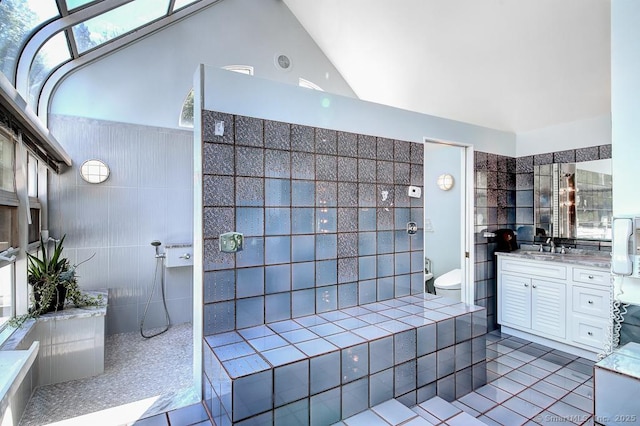 37 Hunting Hill Rd, Woodbridge, CT 06525 - full bathroom featuring tile walls, vanity, toilet, a walk in shower, and lofted ceiling