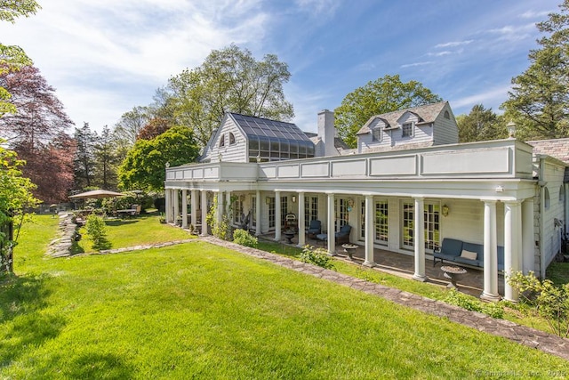 37 Hunting Hill Rd, Woodbridge, CT 06525 - back of house featuring a yard and a chimney