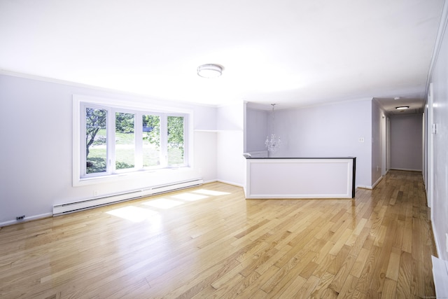 unfurnished living room featuring a baseboard heating unit, crown molding, light wood-style floors, and baseboards