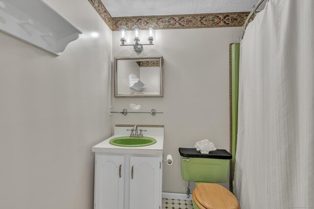 full bathroom featuring vanity and toilet