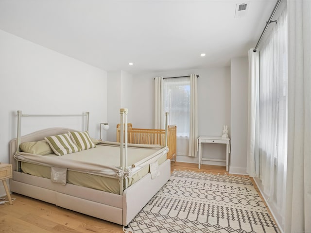 bedroom featuring light wood-style floors and recessed lighting