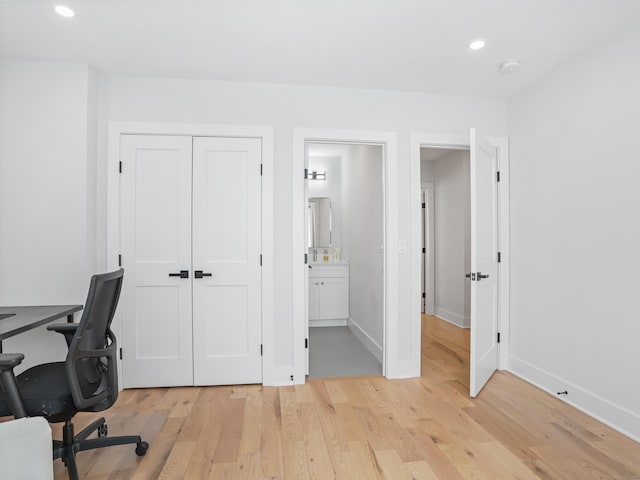 office with light wood-type flooring, recessed lighting, and baseboards