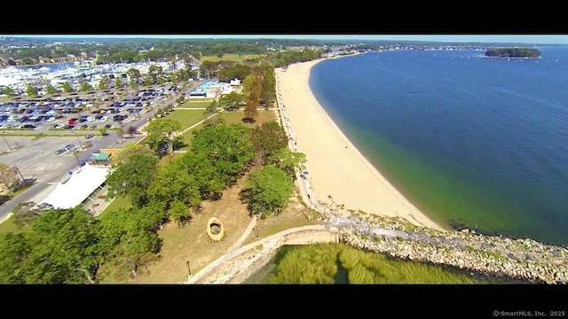 aerial view of property and surrounding area featuring a nearby body of water