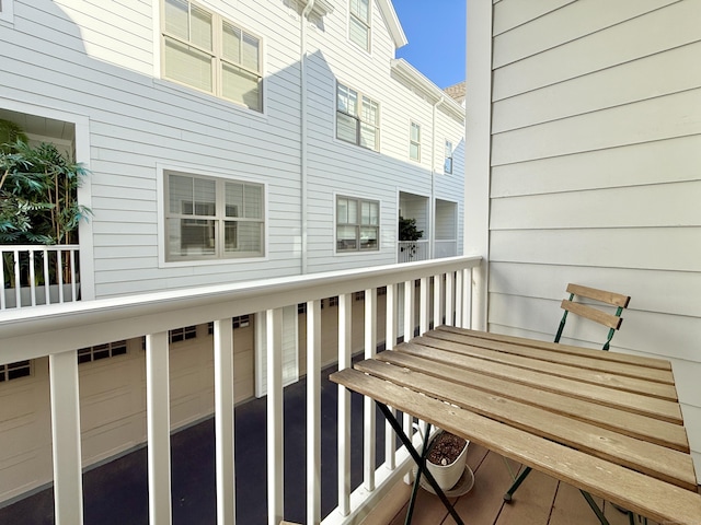 wooden terrace featuring an attached garage