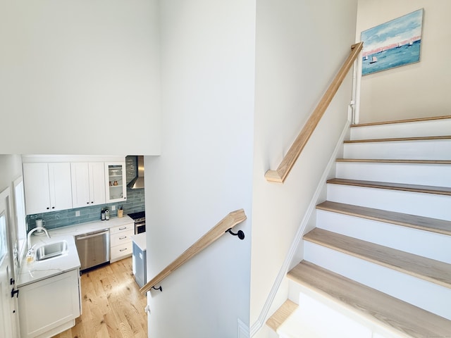 stairway featuring wood finished floors
