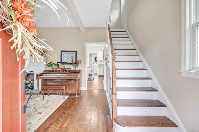 8 Thomas St, Trumbull, CT 06611 - stairway featuring wood finished floors, beamed ceiling, and baseboards