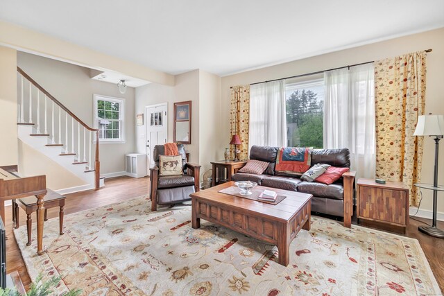8 Thomas St, Trumbull, CT 06611 - living room featuring wood finished floors, stairs, and baseboards
