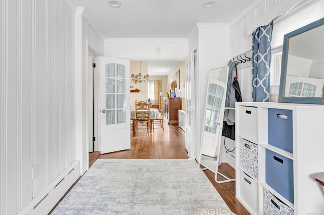 8 Thomas St, Trumbull, CT 06611 - hallway featuring a baseboard radiator, a chandelier, and dark wood-type flooring