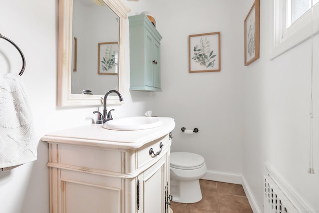 8 Thomas St, Trumbull, CT 06611 - half bath with vanity, toilet, tile patterned floors, and baseboards