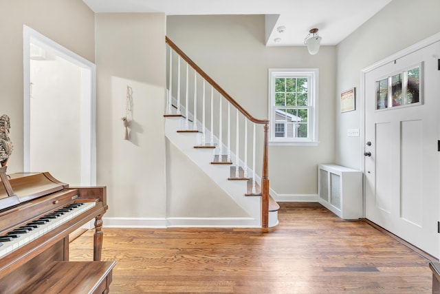 8 Thomas St, Trumbull, CT 06611 - foyer entrance with light wood-type flooring, stairway, and baseboards