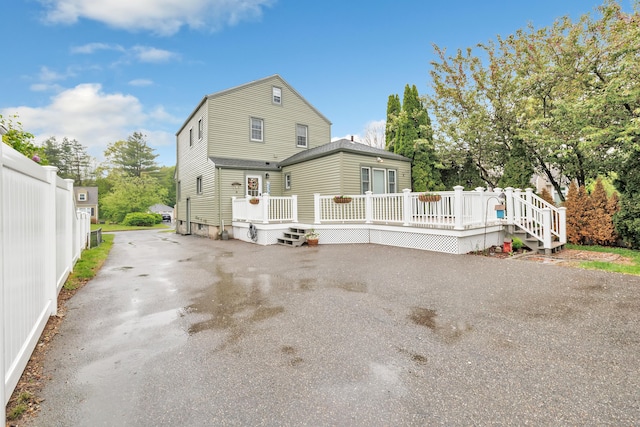 8 Thomas St, Trumbull, CT 06611 - rear view of house featuring a wooden deck and driveway