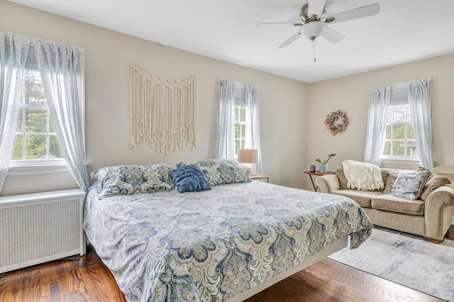 8 Thomas St, Trumbull, CT 06611 - bedroom featuring radiator heating unit, multiple windows, and wood finished floors
