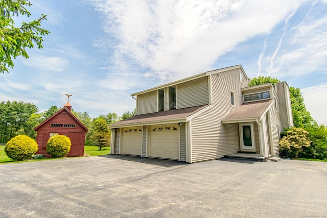 449 E Thompson Rd, Thompson, CT 06277 - view of front of home featuring driveway and a garage