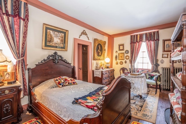 1066 Washington St, Middletown, CT 06457 - bedroom featuring radiator heating unit and wood finished floors