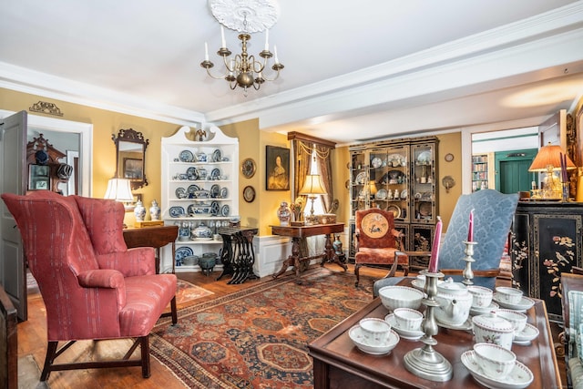 1066 Washington St, Middletown, CT 06457 - living area featuring a chandelier, wood finished floors, and ornamental molding
