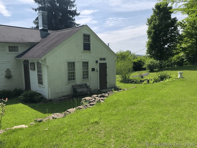 1066 Washington St, Middletown, CT 06457 - rear view of house with a yard and a chimney