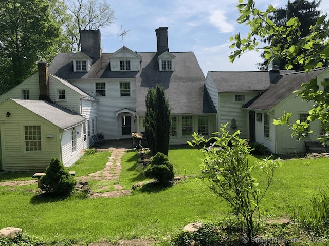 1066 Washington St, Middletown, CT 06457 - back of property featuring a lawn and a chimney