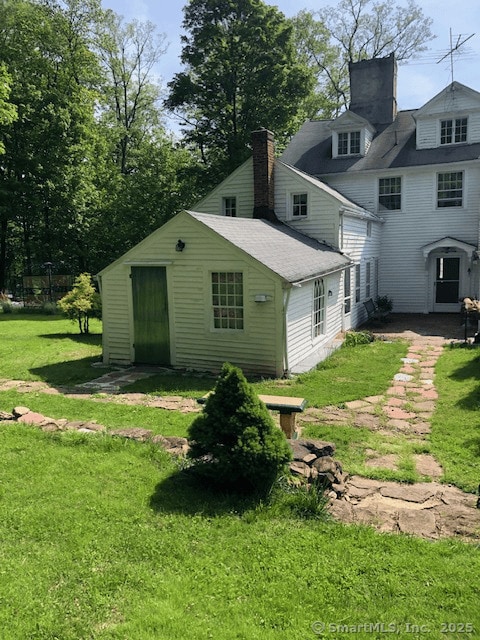 1066 Washington St, Middletown, CT 06457 - rear view of property with a lawn, a chimney, and a shingled roof
