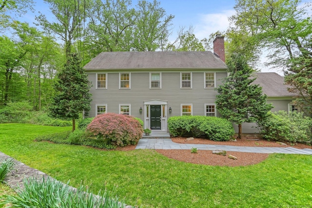 85 Whiting Pond Rd, Fairfield, CT 06824 - view of front of property with a chimney and a front lawn