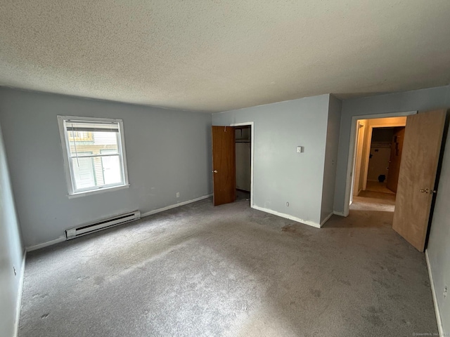248 Lawlor St Apt 1, New Britain, CT 06051 - unfurnished bedroom with baseboard heating, a textured ceiling, carpet floors, a closet, and baseboards
