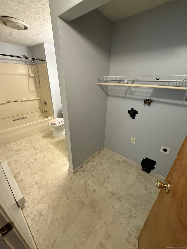 248 Lawlor St Apt 1, New Britain, CT 06051 - laundry room with a textured ceiling
