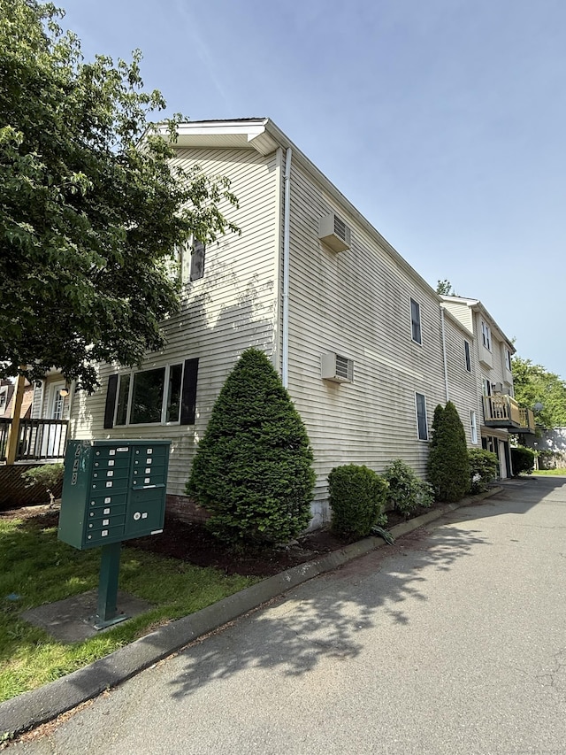 248 Lawlor St Apt 1, New Britain, CT 06051 - view of property exterior featuring mail area and an AC wall unit