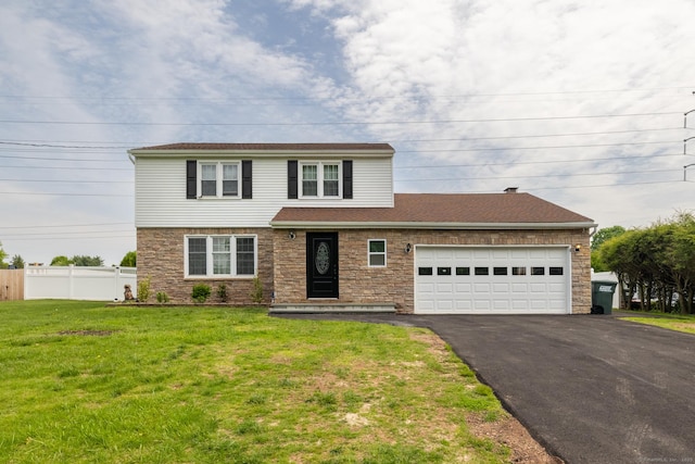 105 Reussner Rd, Southington, CT 06489 - view of front of home featuring driveway, an attached garage, and stone siding