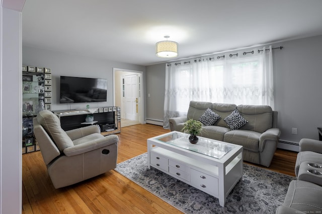 105 Reussner Rd, Southington, CT 06489 - living room with a baseboard radiator and light wood-style flooring