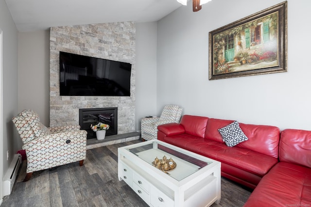 105 Reussner Rd, Southington, CT 06489 - living room with a stone fireplace, dark wood-style floors, a baseboard radiator, and lofted ceiling