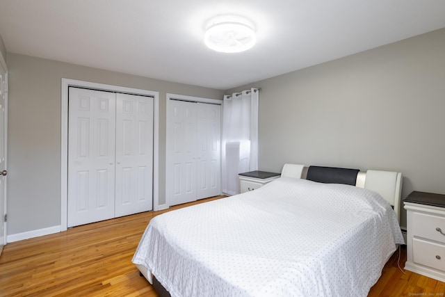 105 Reussner Rd, Southington, CT 06489 - bedroom with two closets, light wood finished floors, and baseboards