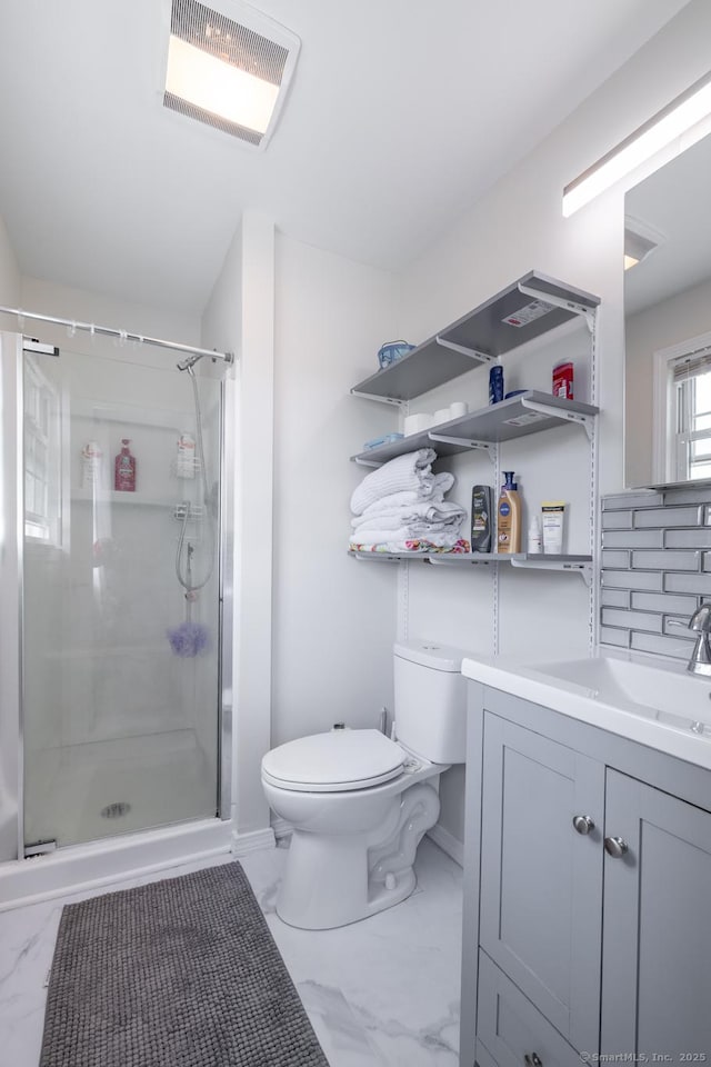 105 Reussner Rd, Southington, CT 06489 - bathroom featuring marble look tiles, toilet, a shower stall, and vanity