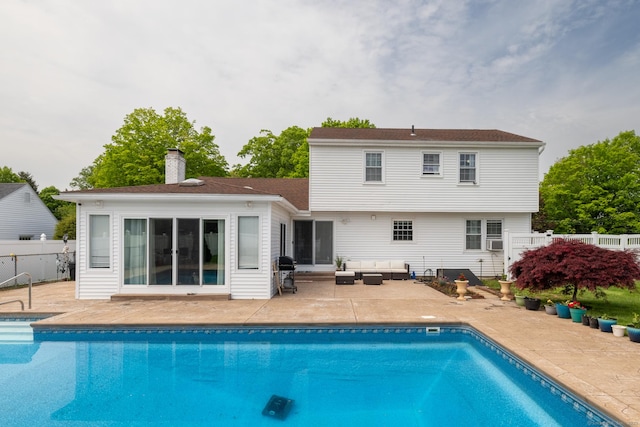 105 Reussner Rd, Southington, CT 06489 - back of property with a patio area, a chimney, an outdoor living space, fence, and cooling unit