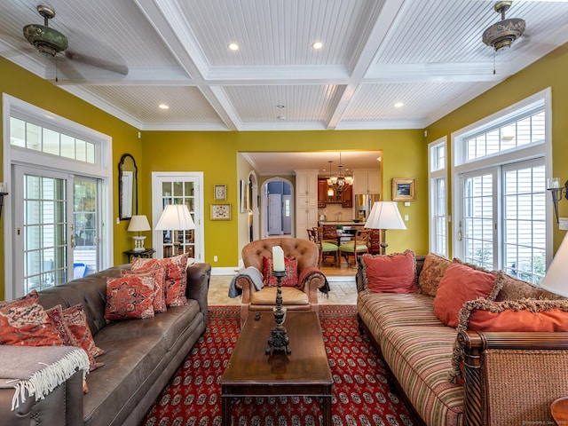 living area featuring coffered ceiling, a chandelier, recessed lighting, healthy amount of natural light, and ornamental molding