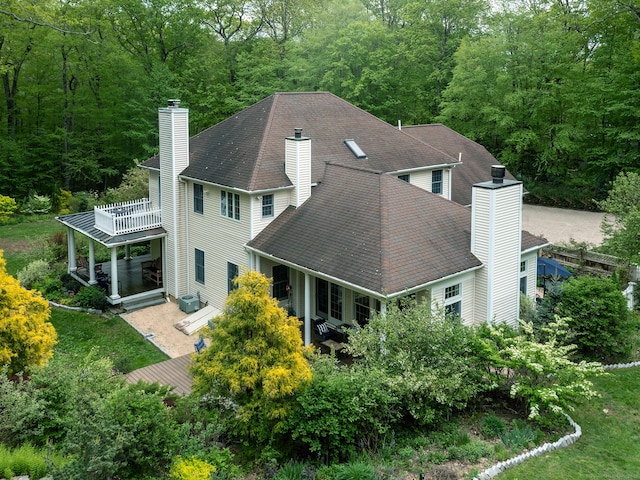 view of subject property with a forest