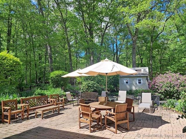 70 Bayne St, Norwalk, CT 06851 - view of patio / terrace featuring an outbuilding and outdoor dining space