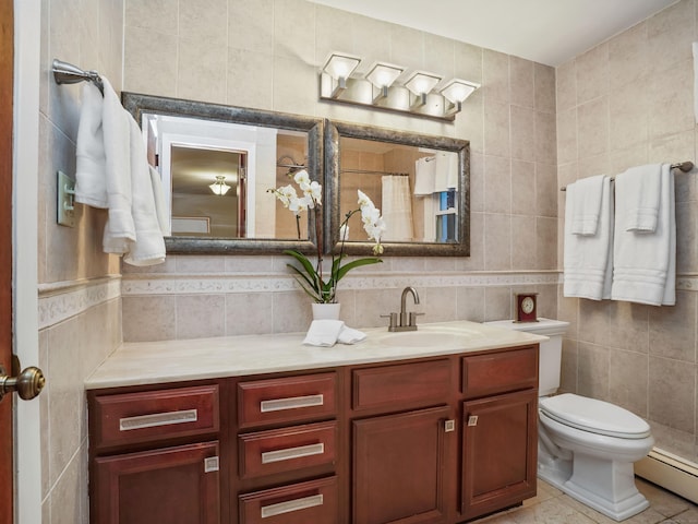 bathroom with tile walls, a baseboard radiator, toilet, vanity, and tile patterned floors