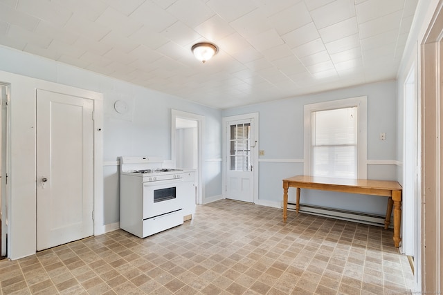 14 Palmer St, Killingly, CT 06239 - kitchen with white range with gas stovetop, baseboard heating, baseboards, and light countertops