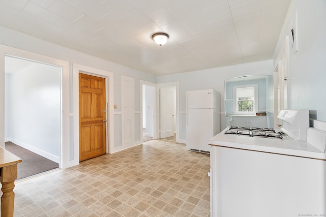 14 Palmer St, Killingly, CT 06239 - kitchen featuring freestanding refrigerator, range, light countertops, and light flooring