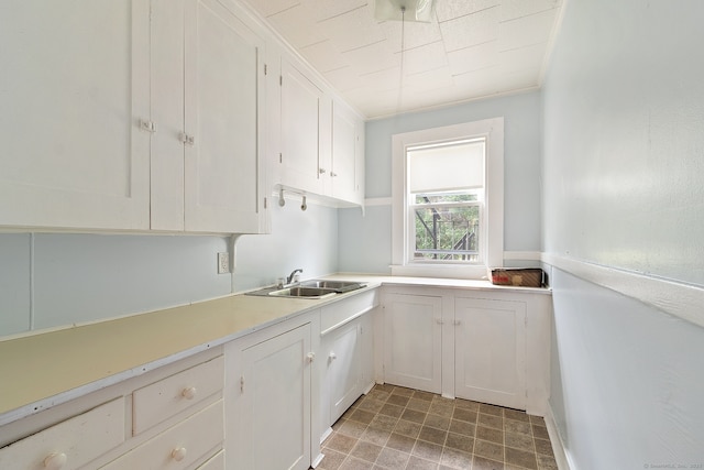 14 Palmer St, Killingly, CT 06239 - kitchen with a sink, white cabinetry, and light countertops