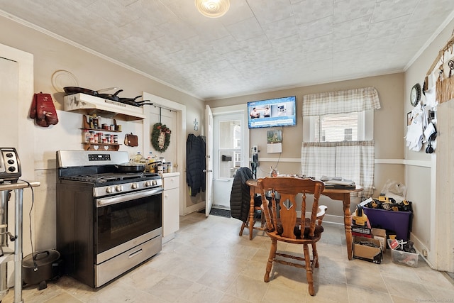 14 Palmer St, Killingly, CT 06239 - kitchen featuring stainless steel range with gas cooktop, crown molding, open shelves, and baseboards