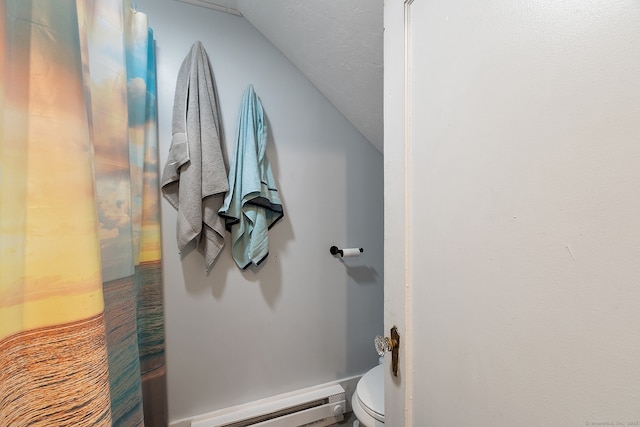 14 Palmer St, Killingly, CT 06239 - bathroom featuring vaulted ceiling, a baseboard heating unit, and toilet