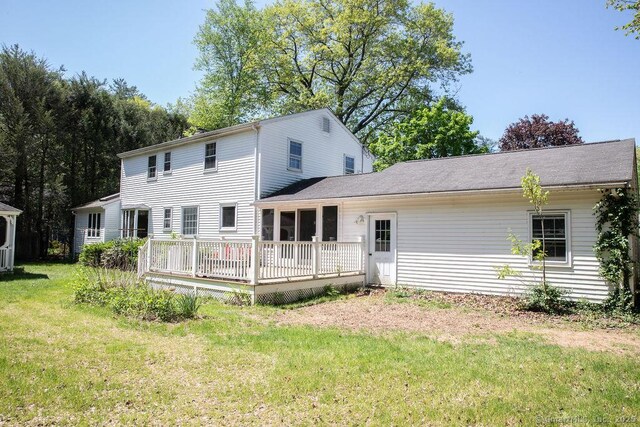 47 Hillside Ave, Farmington, CT 06085 - rear view of house with a wooden deck and a yard